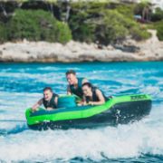 Guests Enjoying The Jobe Sports Rodeo 2 Towable Tube On The Ocean, Unlimited Fun For Guests. Super-Easy To Climb Back Into. Fast Inflate And Connect. 3 Year Warranty.