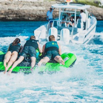 Yacht Crews Quickly And Easily Deploying The Premium Rodeo 2 Towable Tube Towable Inflatable From The Swim Platform