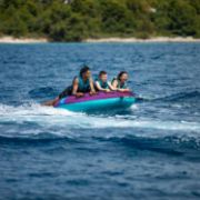 Crew Demonstrating The Compact Footprint And Easy Storage Of The Jobe Sports Droplet 3 Towable Tube Towable Inflatable