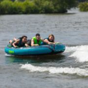 Charter Guests Enjoying The Compound 3 Towable Tube, High-End Water Sports Equipment From Yacht Toys™