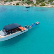 Guests Enjoying The Jobe Sports Switch 2 Towable Tube On The Ocean, A Great Towable And Slide In One. Hours Of Fun For All Ages. Fast Inflate And Connect. 3 Year Warranty.