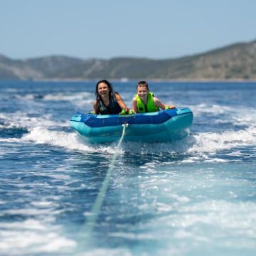 Yacht Crews Quickly And Easily Deploying The Premium Airstream 2 Towable Tube Towable Inflatable From The Swim Platform