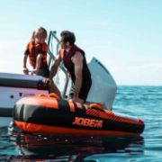 Yacht Crews Quickly And Easily Deploying The Premium Tribal 2 Towable Tube Towable Inflatable From The Swim Platform