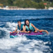 Charter Guests Enjoying The Droplet 2 Towable Tube, High-End Water Sports Equipment From Yacht Toys™