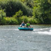 Charter Guests Enjoying The Compound 2 Towable Tube, High-End Water Sports Equipment From Yacht Toys™