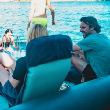 Guests Enjoying The Jobe Sports Chair Towel Midnight Blue On The Ocean, Take Your Infinity Loungers To The Next Level. Light, Long Lasting, And Uv / Salt Water Resistant.