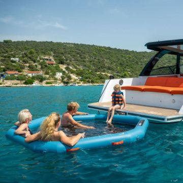 Crew Demonstrating The Compact Footprint And Easy Storage Of The Jobe Sports Infinity Water Hammock Platform