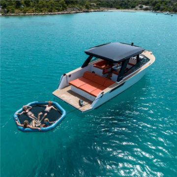 Charter Guests Enjoying The Infinity Water Hammock, High-End Water Sports Equipment From Yacht Toys™