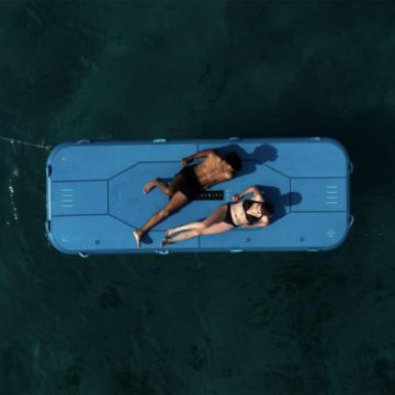 Charter Guests Enjoying The Infinity Platform, High-End Water Sports Equipment From Yacht Toys™