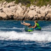 Crew Demonstrating The Compact Footprint And Easy Storage Of The Jobe Sports Hotseat 1 Towable Tube Towable Inflatable