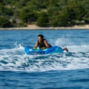 Crew Demonstrating The Compact Footprint And Easy Storage Of The Jobe Sports Airstream 1 Towable Tube Towable Inflatable
