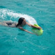 Charter Guests Enjoying The Flux Kickboard, High-End Water Sports Equipment From Yacht Toys™