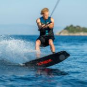 Crew Demonstrating The Compact Footprint And Easy Storage Of The Jobe Sports Logo Wakeboard