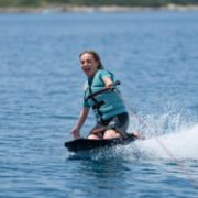 Crew Demonstrating The Compact Footprint And Easy Storage Of The Jobe Sports Slash Kneeboard