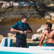 The Jobe Sports Perth 3/2Mm Shorty Wetsuit Arranged On A Superyacht Beach Club Platform