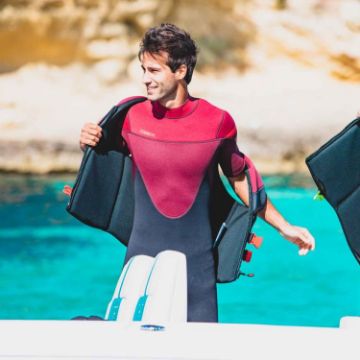 The Jobe Sports Perth 3/2Mm Shorty Wetsuit Arranged On A Superyacht Beach Club Platform