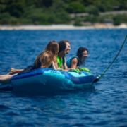 Charter Guests Enjoying The Airstream Towable 4P, High-End Water Sports Equipment From Yacht Toys™