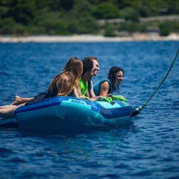 Charter Guests Enjoying The Airstream Towable 4P, High-End Water Sports Equipment From Yacht Toys™
