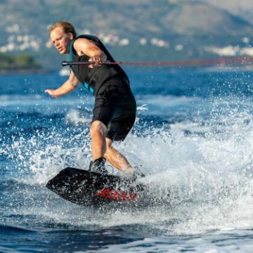 The Yacht Toys Core Logo Wakeboard Bundle Arranged On A Superyacht Beach Club Platform